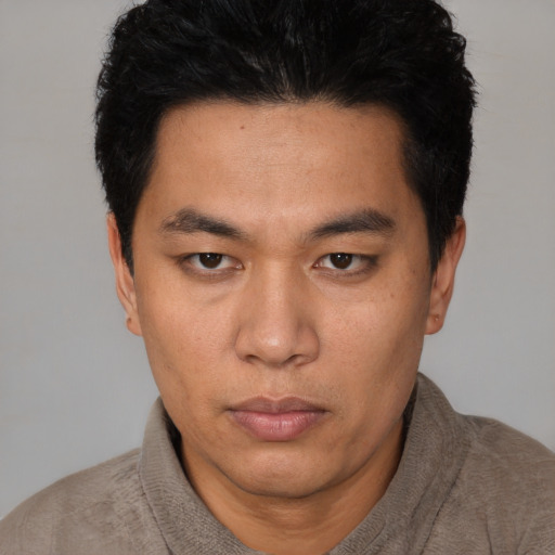 Neutral asian young-adult male with short  black hair and brown eyes