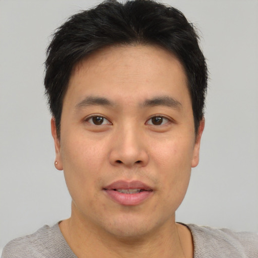 Neutral asian young-adult male with short  brown hair and brown eyes
