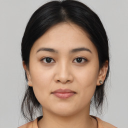 Joyful asian young-adult female with medium  black hair and brown eyes