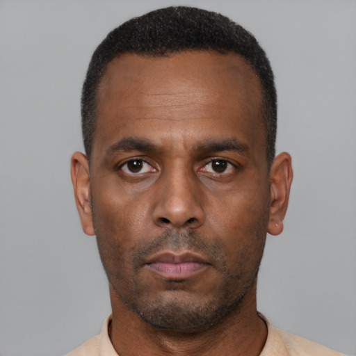 Neutral latino adult male with short  black hair and brown eyes