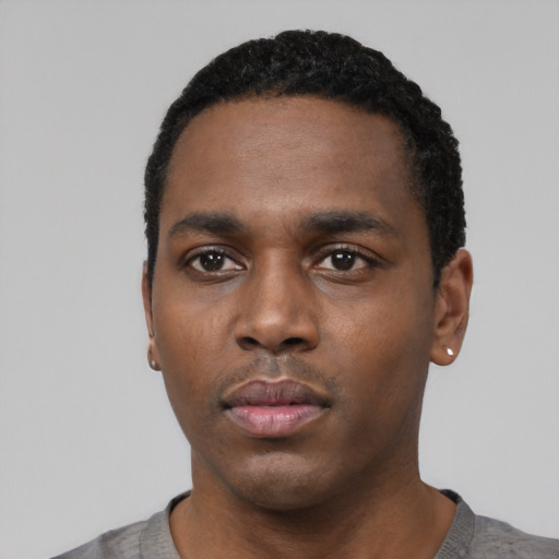 Neutral black young-adult male with short  black hair and brown eyes