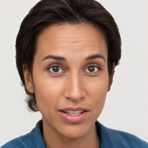 Joyful white young-adult female with short  brown hair and brown eyes