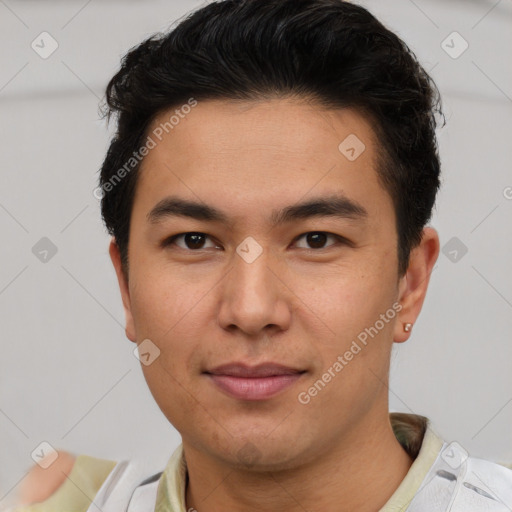 Joyful asian young-adult male with short  brown hair and brown eyes