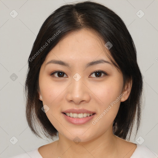 Joyful asian young-adult female with medium  brown hair and brown eyes