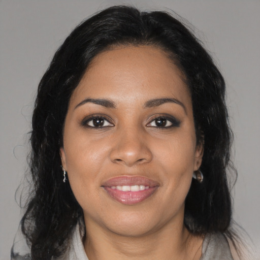 Joyful black young-adult female with medium  black hair and brown eyes