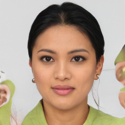 Joyful asian young-adult female with medium  brown hair and brown eyes