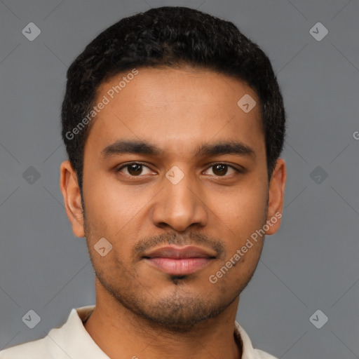 Joyful latino young-adult male with short  brown hair and brown eyes