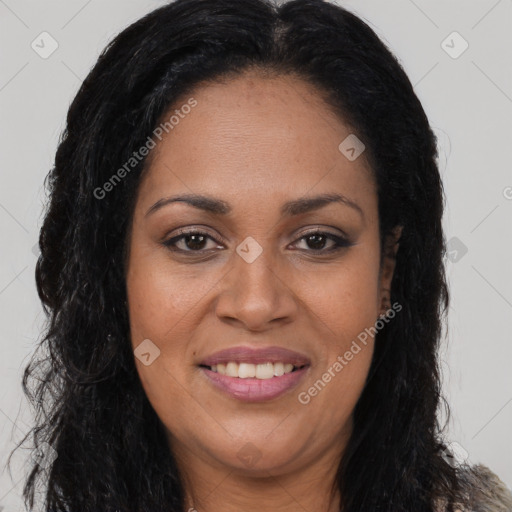 Joyful black adult female with long  brown hair and brown eyes