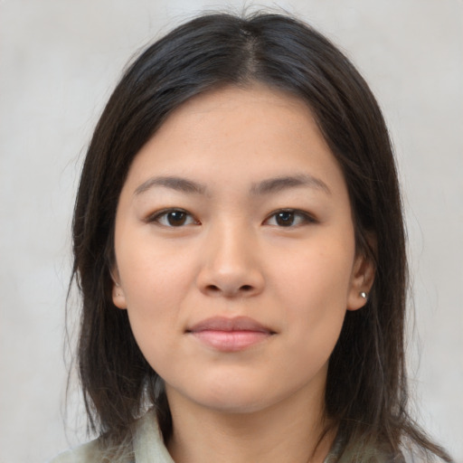 Neutral latino young-adult female with medium  brown hair and brown eyes