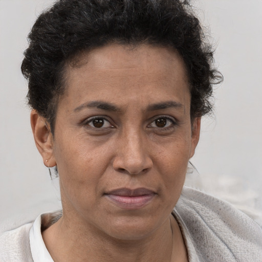 Joyful white adult female with short  brown hair and brown eyes