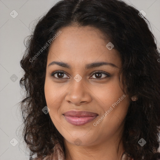 Joyful black young-adult female with long  brown hair and brown eyes