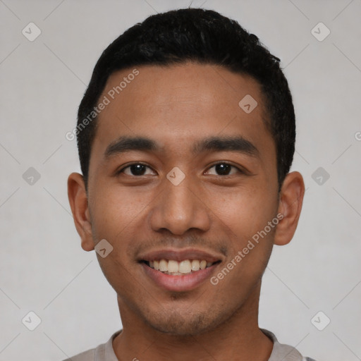 Joyful latino young-adult male with short  black hair and brown eyes