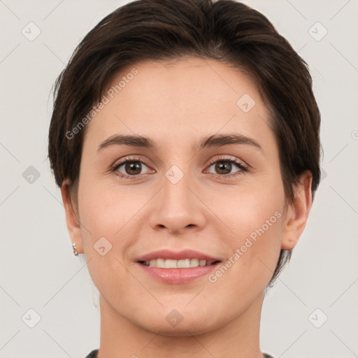 Joyful white young-adult female with short  brown hair and brown eyes