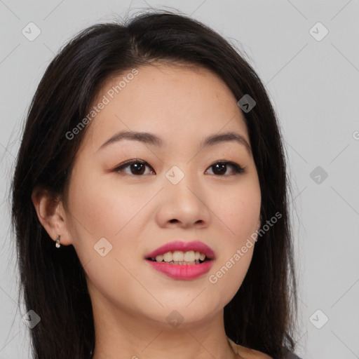 Joyful asian young-adult female with long  brown hair and brown eyes