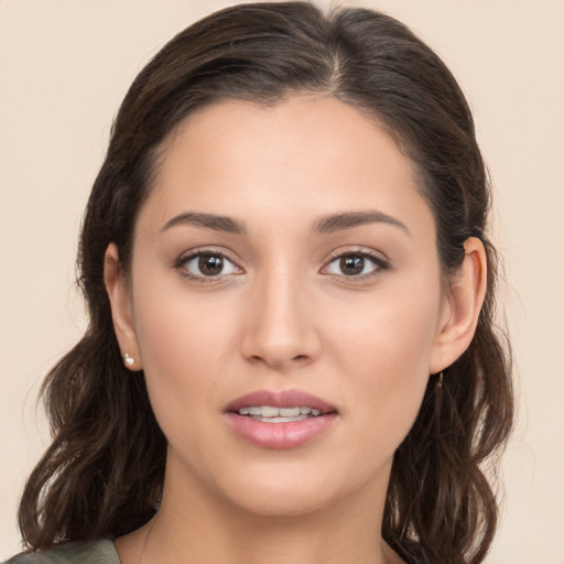 Joyful white young-adult female with medium  brown hair and brown eyes