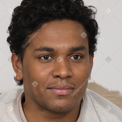 Joyful black young-adult male with short  brown hair and brown eyes