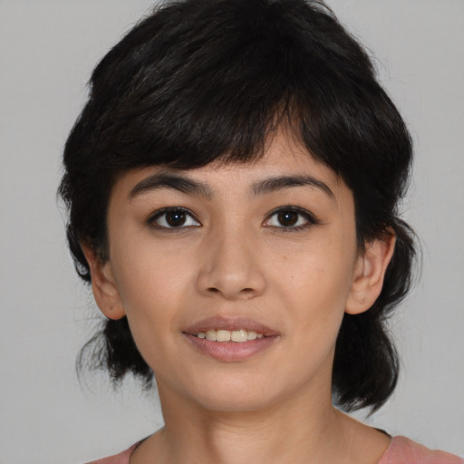 Joyful latino young-adult female with medium  black hair and brown eyes