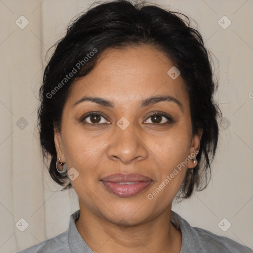 Joyful black adult female with medium  brown hair and brown eyes