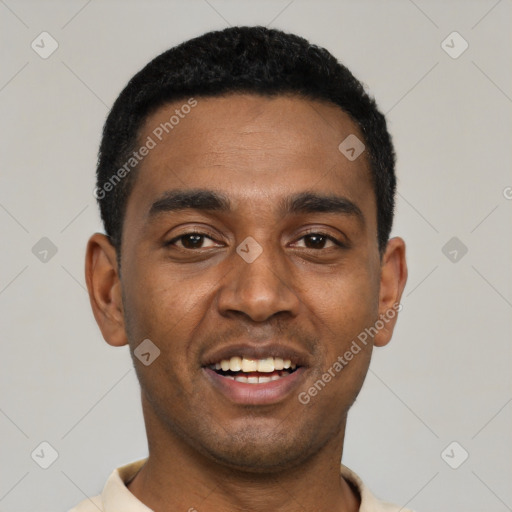 Joyful black young-adult male with short  black hair and brown eyes