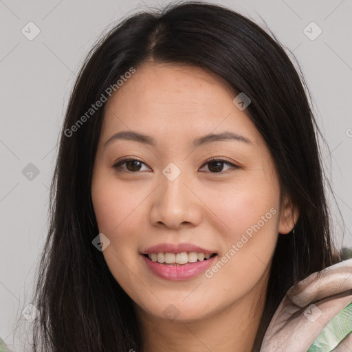 Joyful asian young-adult female with long  brown hair and brown eyes