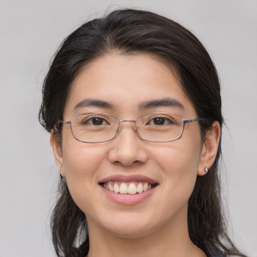 Joyful white young-adult female with medium  brown hair and brown eyes