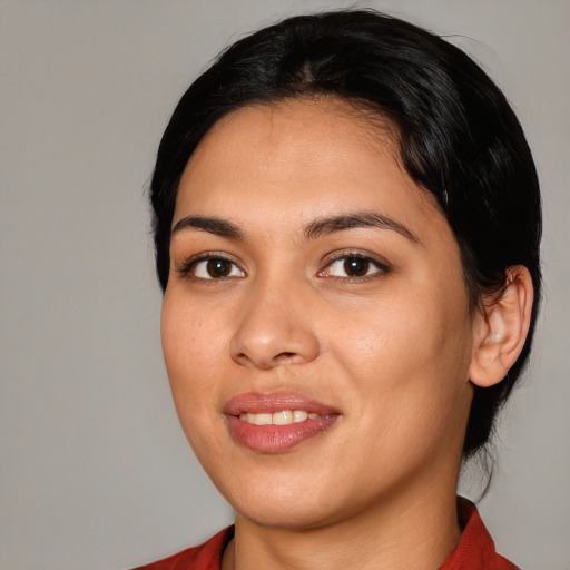 Joyful white young-adult female with medium  black hair and brown eyes