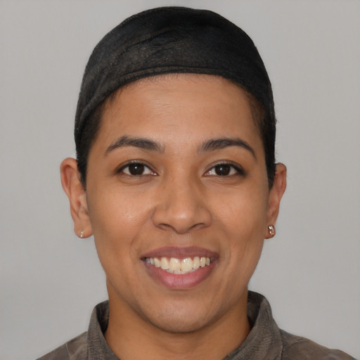 Joyful latino young-adult female with short  black hair and brown eyes