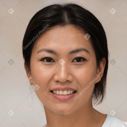 Joyful asian young-adult female with short  brown hair and brown eyes