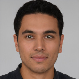 Neutral latino young-adult male with short  brown hair and brown eyes