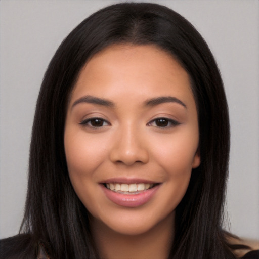 Joyful latino young-adult female with long  brown hair and brown eyes