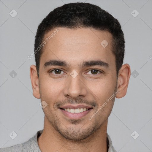 Joyful white young-adult male with short  black hair and brown eyes