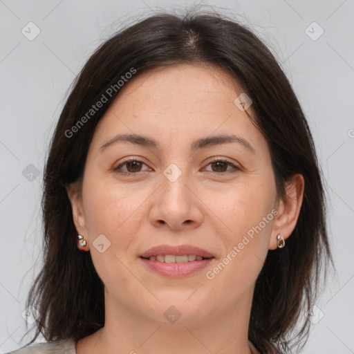 Joyful white adult female with medium  brown hair and brown eyes