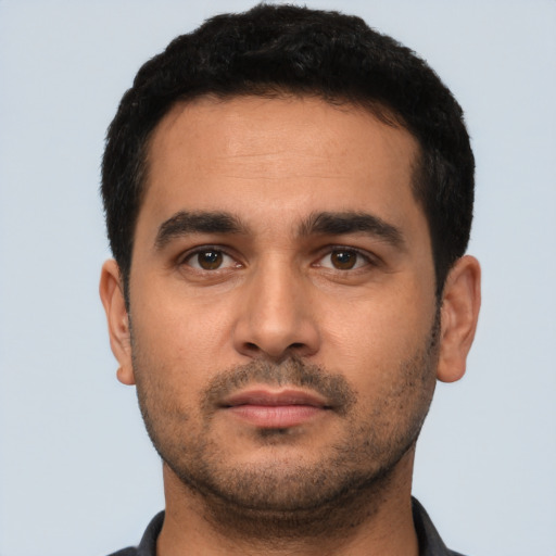 Neutral latino young-adult male with short  black hair and brown eyes