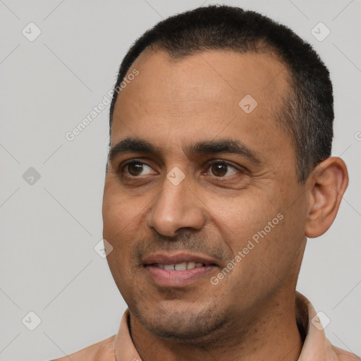 Joyful white adult male with short  black hair and brown eyes