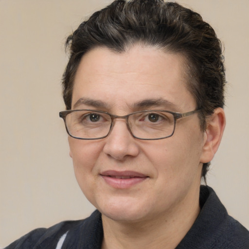 Joyful white adult female with short  brown hair and brown eyes