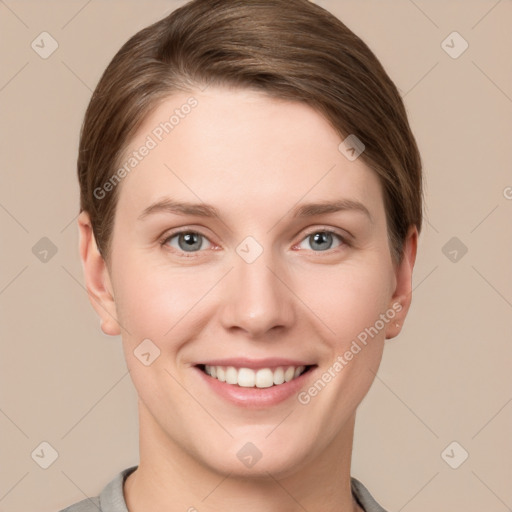 Joyful white young-adult female with short  brown hair and grey eyes