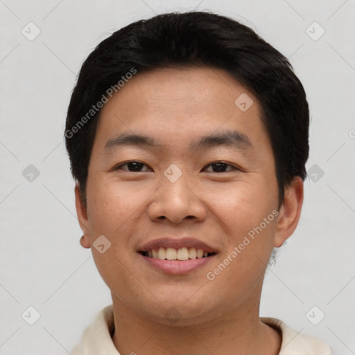 Joyful asian young-adult male with short  black hair and brown eyes