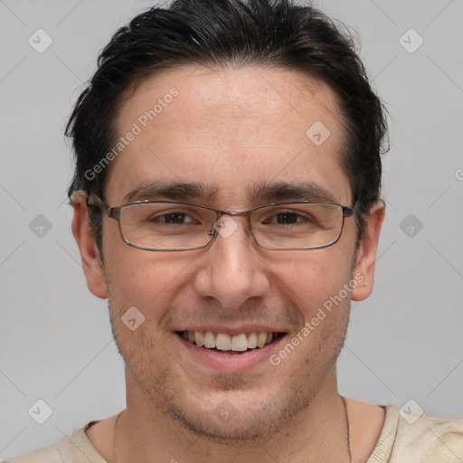 Joyful white adult male with short  brown hair and brown eyes