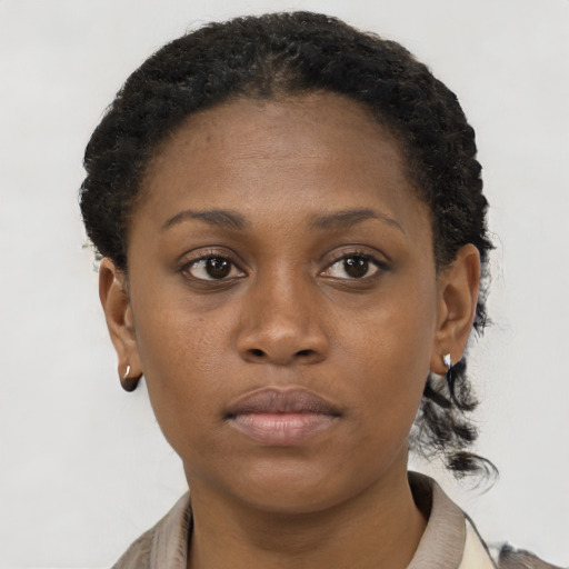 Neutral black young-adult female with short  brown hair and brown eyes