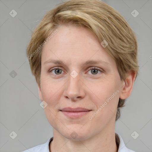 Joyful white adult female with short  brown hair and grey eyes