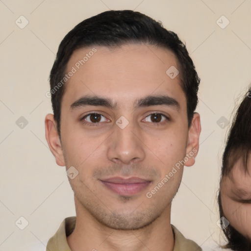 Joyful latino young-adult male with short  black hair and brown eyes