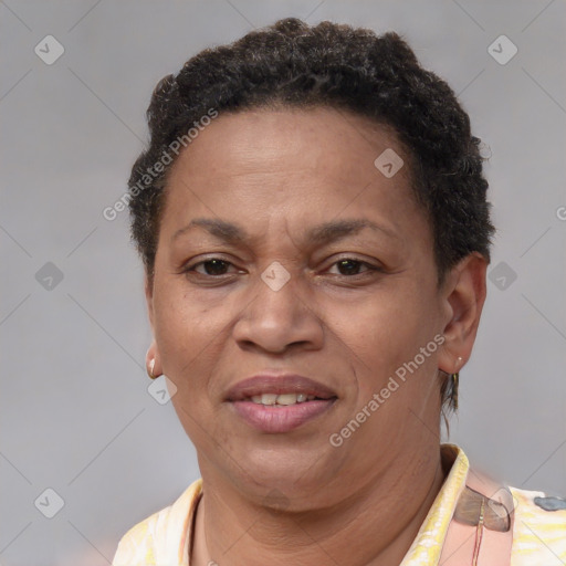 Joyful latino adult female with short  brown hair and brown eyes