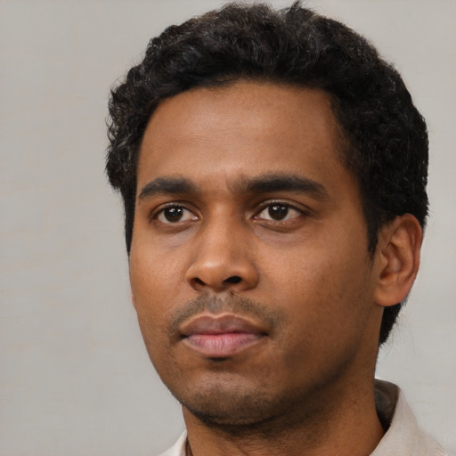 Neutral black young-adult male with short  black hair and brown eyes