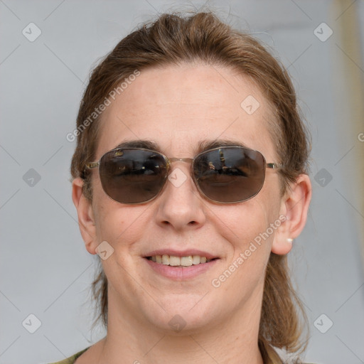 Joyful white young-adult female with medium  brown hair and blue eyes