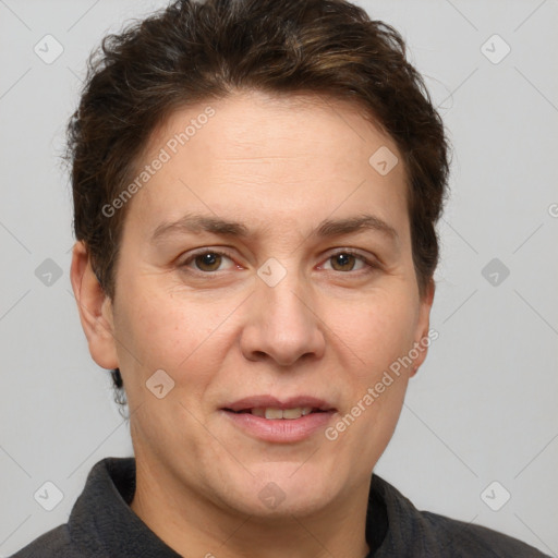 Joyful white adult female with short  brown hair and grey eyes