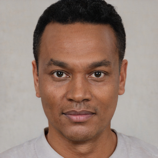 Neutral black young-adult male with short  black hair and brown eyes
