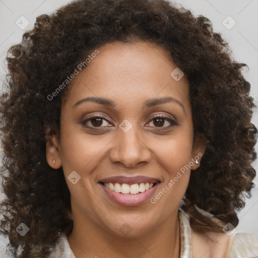 Joyful black young-adult female with medium  brown hair and brown eyes