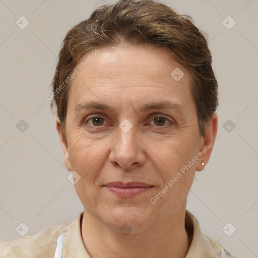 Joyful white adult female with short  brown hair and brown eyes