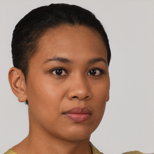 Joyful latino young-adult female with short  brown hair and brown eyes