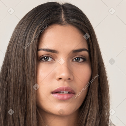 Neutral white young-adult female with long  brown hair and brown eyes